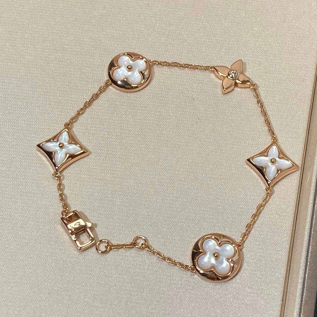 [Garvey ]STAR AND SUN 5 MOTIF MOP PINK GOLD BRACELET