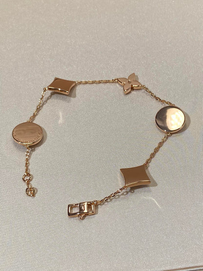 [Garvey ]STAR AND SUN 5 MOTIF MOP PINK GOLD BRACELET