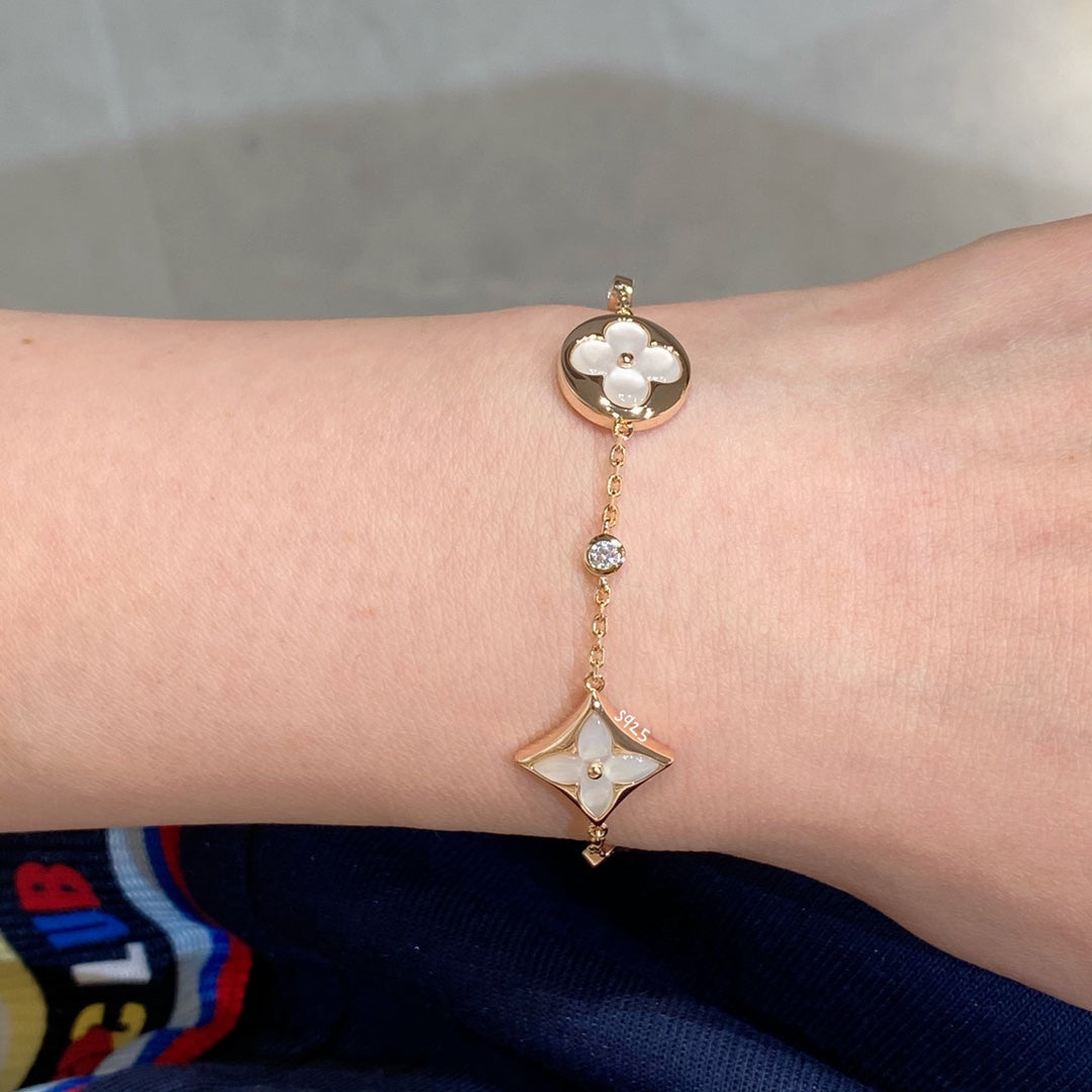 [Garvey ]STAR AND SUN 4 MOTIF WHITE MOP PINK GOLD BRACELET